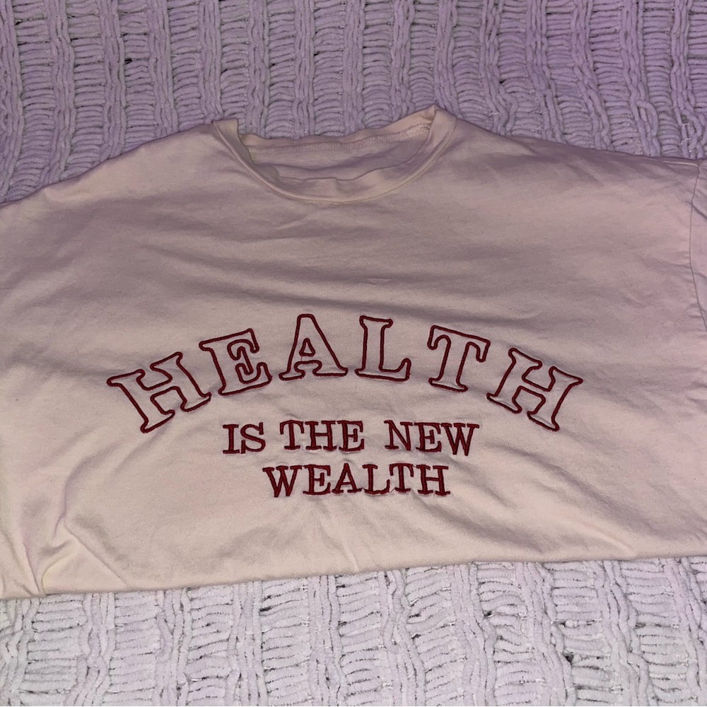 Graphic tees, used,beige shirt is an oversized fit